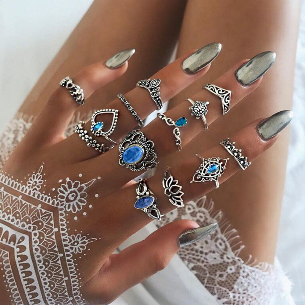 A woman's hand with several Maramalive™ Boho Hand Jewelry Rings | MaramaliveTM