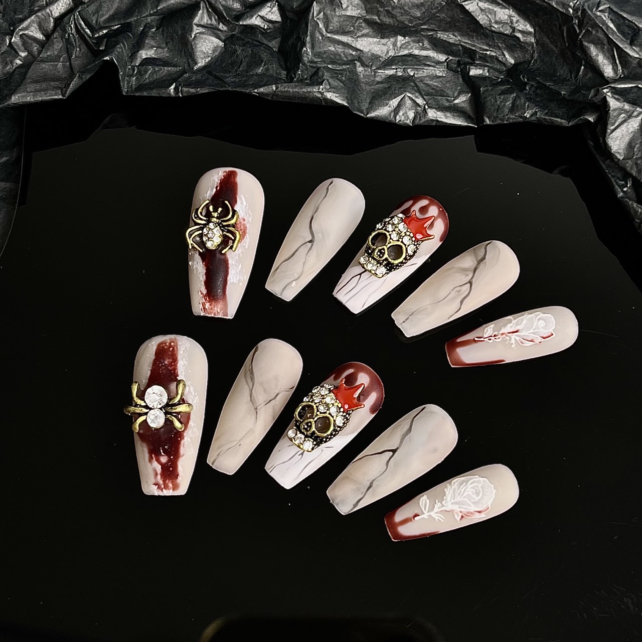 A group of Maramalive™ Gothic Halloween Wear Armor Three-dimensional Spider Nails with blood on them.