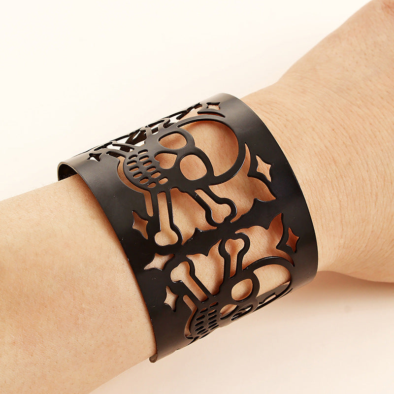 A Maramalive™ ladies iron BraceletBlack Skull Bracelet Vintage Punk Gothic Wide Cuff Wristband with a skull and crossbones design, electroplated with alloy.