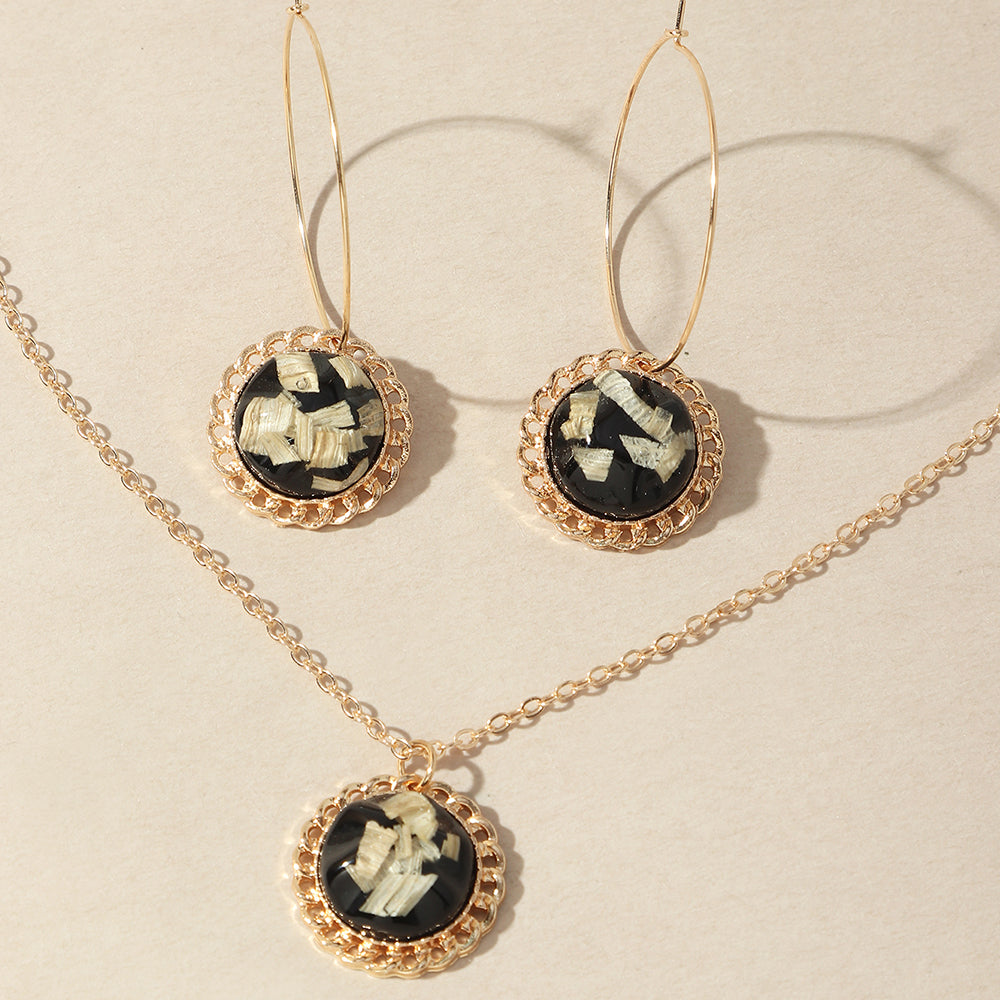 A Maramalive™ Simple All-match Jewelry Set consisting of a black and gold necklace and earrings.