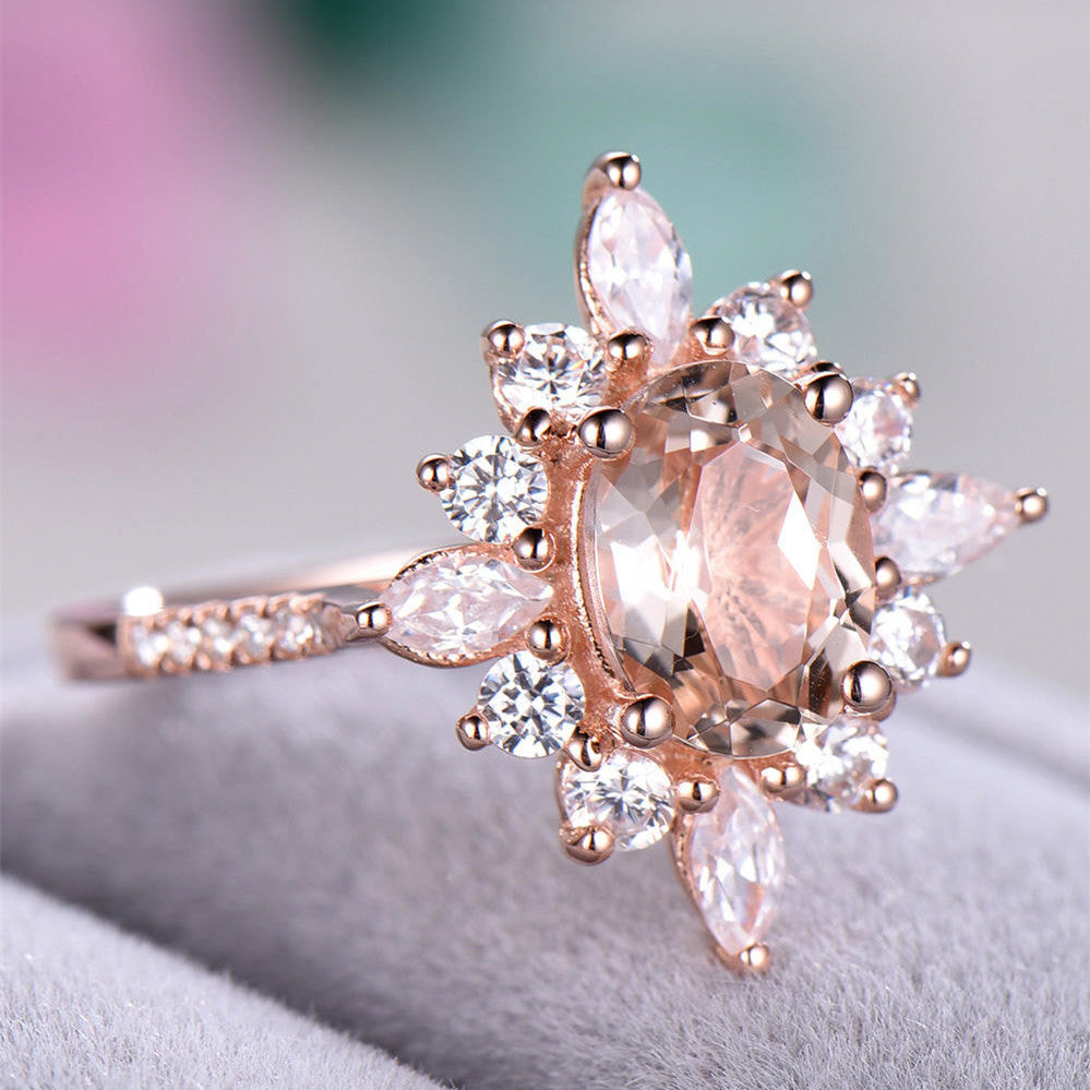 An engagement ring from Maramalive™ with a cluster of white diamonds.