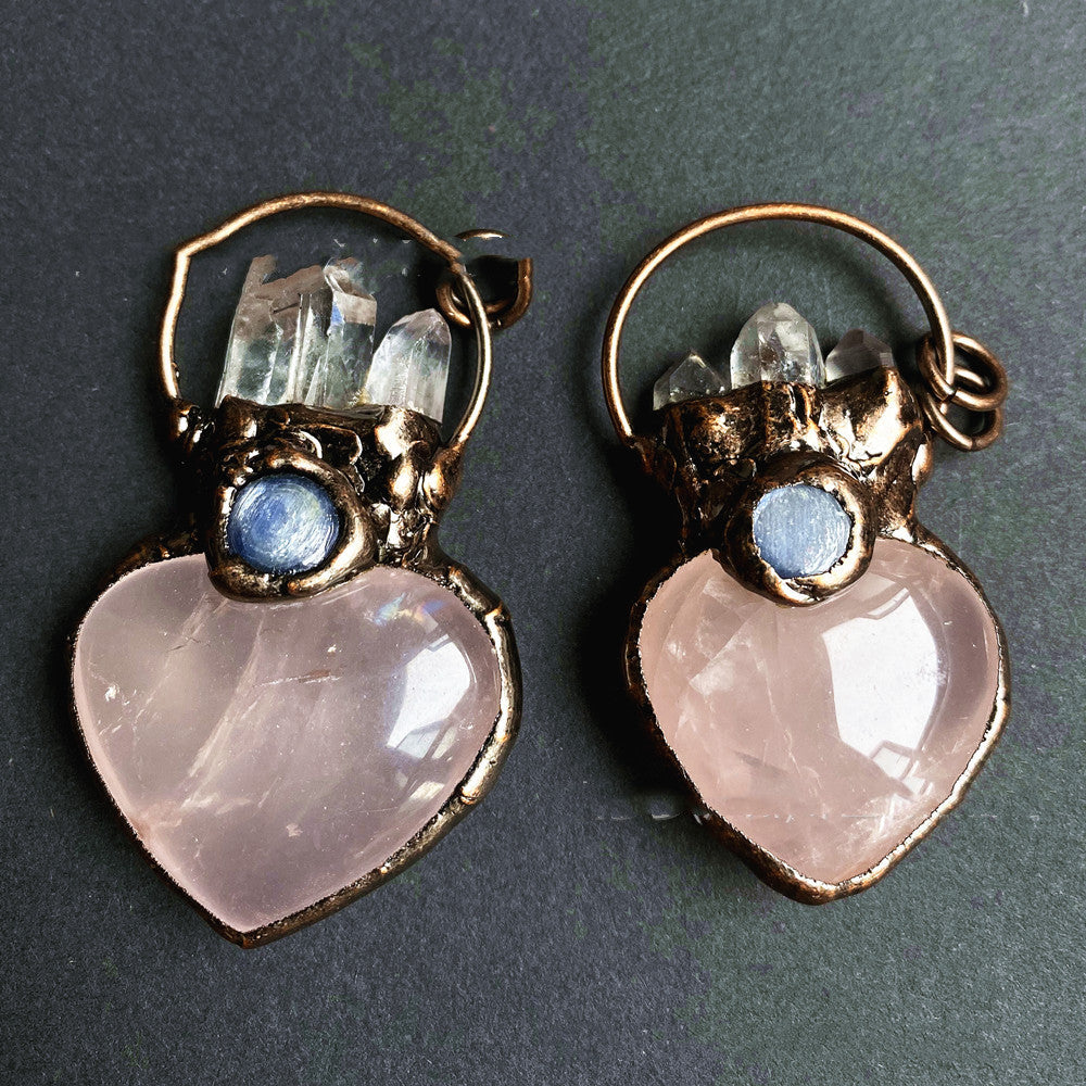 A pair of Heart-shaped White Crystal Pillar Aquamarine earrings from Maramalive™.