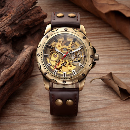 A Maramalive™ Mens Skeleton Steampunk Automatic Mechanical Watch sitting on top of a wooden table.