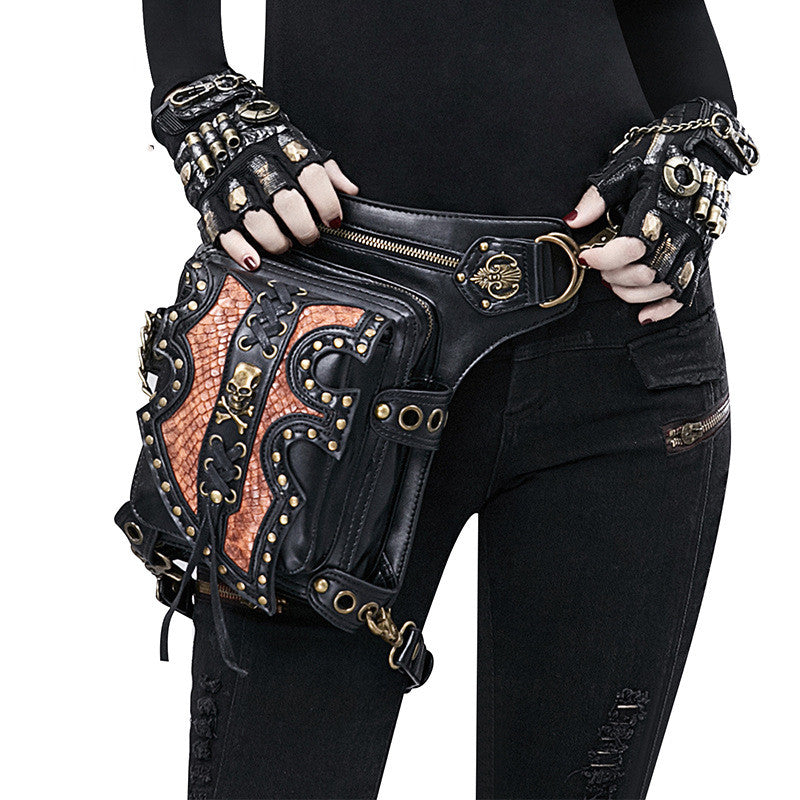 A woman is holding a Maramalive™ Steampunk Motorcycle Bag, a black and gold fanny pack, multiple-use bag for the adventurer.