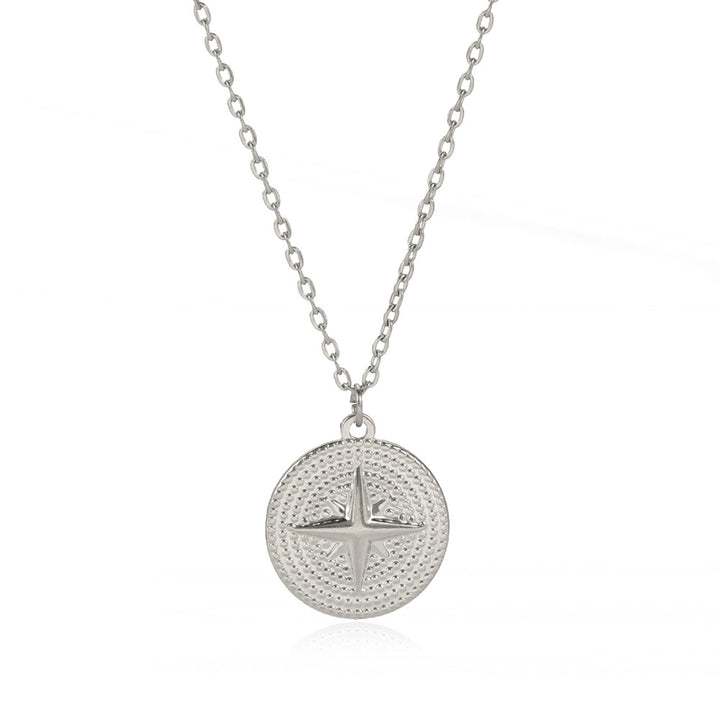 A woman wearing a Maramalive™ Titanium Steel Oil Pressure Round Brand Four Octagram Necklace.