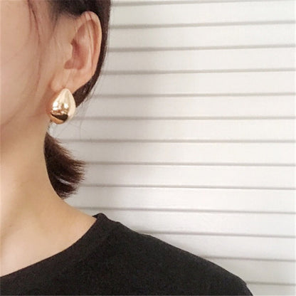 A person holding a pair of Maramalive™ Retro Drop Earrings.