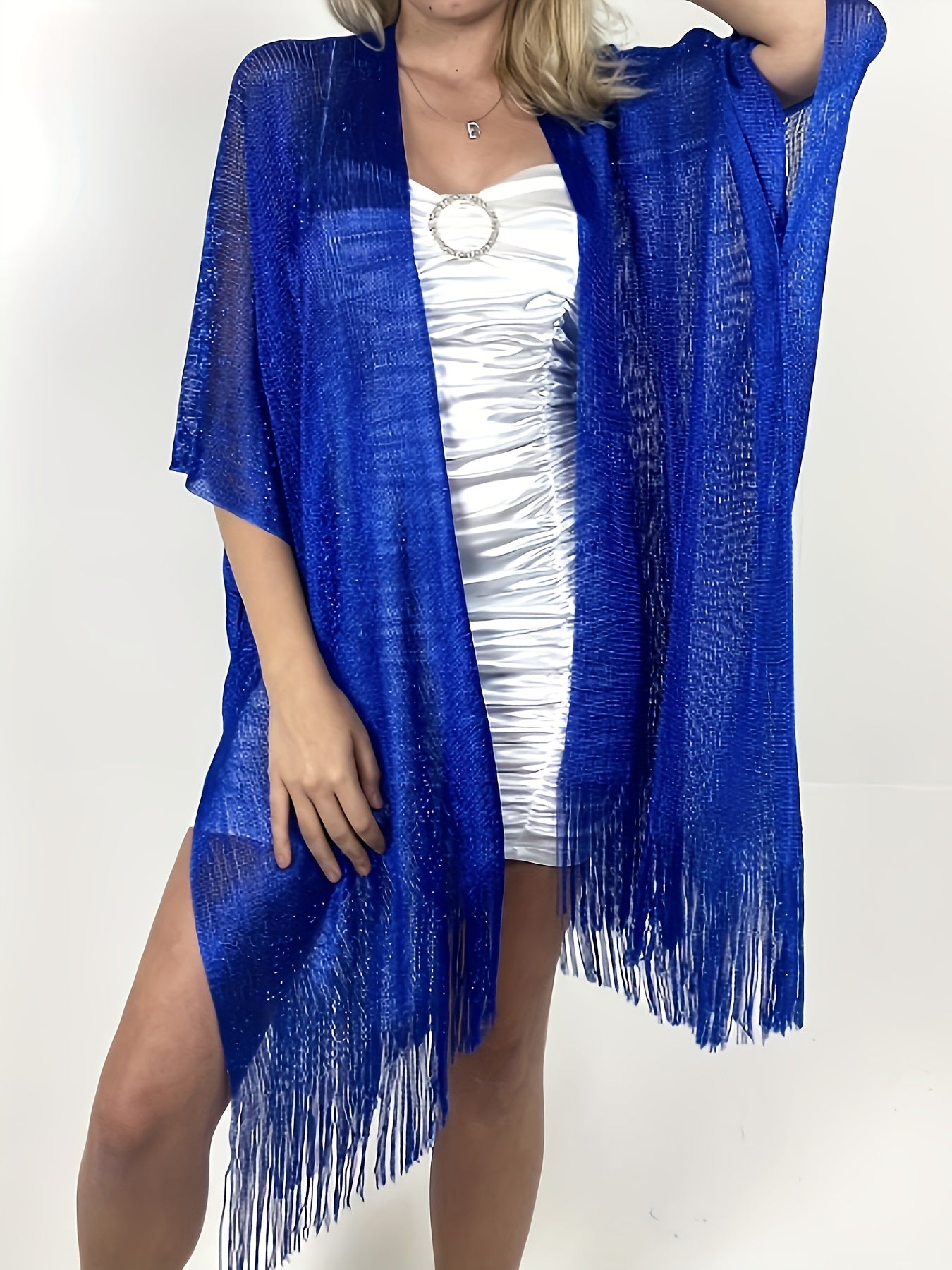 Woman wearing a vibrant blue, fringed shawl over an elegant polyester dress with a ruched design, from Maramalive™'s Plus Size Split Tassel Top, Casual Open Front Top For Summer, Women's Plus Size Clothing collection.