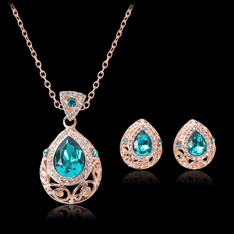 A necklace and earring set with blue crystals called the Amazing Jewelry Set Hollow pattern jewelry set Earrings and Necklace Pendant by Maramalive™.