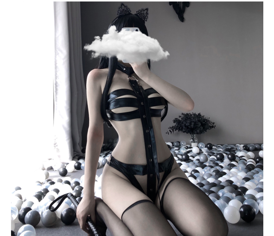A woman in black lingerie with a Maramalive™ patent leather bodysuit sitting on a cloud.