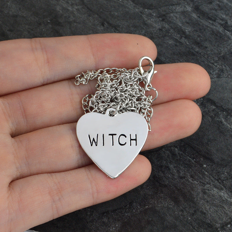 A person holding a silver Witch Necklace Creative Love Halloween Necklace with the word "witch" on it. Brand: Maramalive™