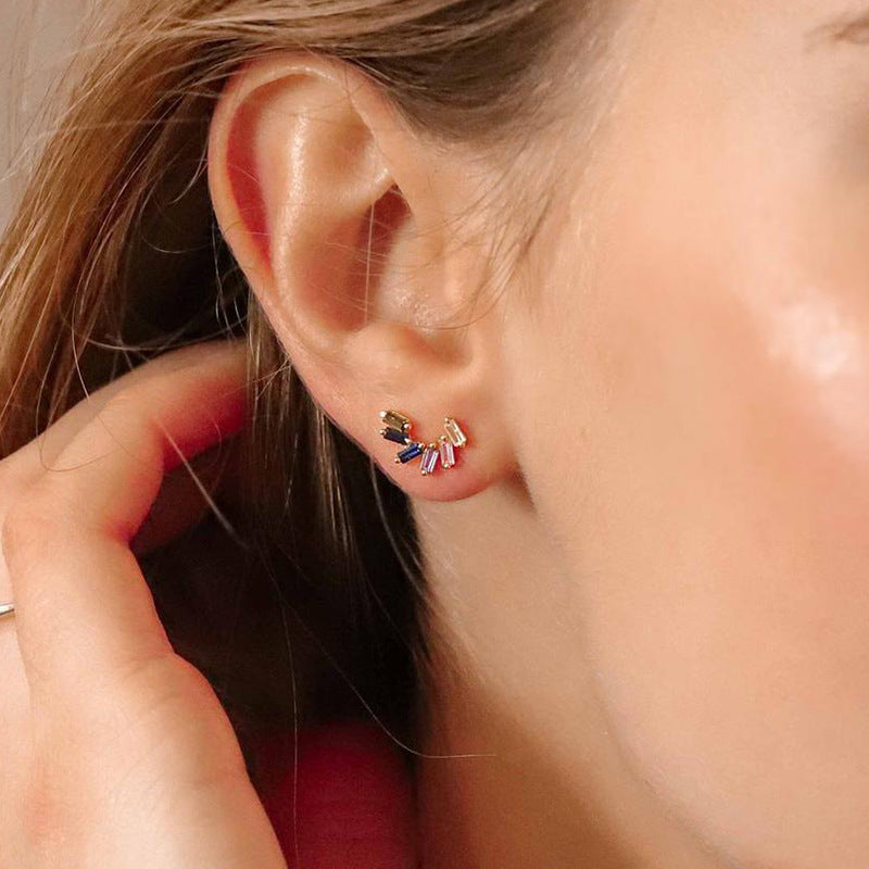 A woman's ear with a Maramalive™ Silver Needle Zircon Earring for Women.