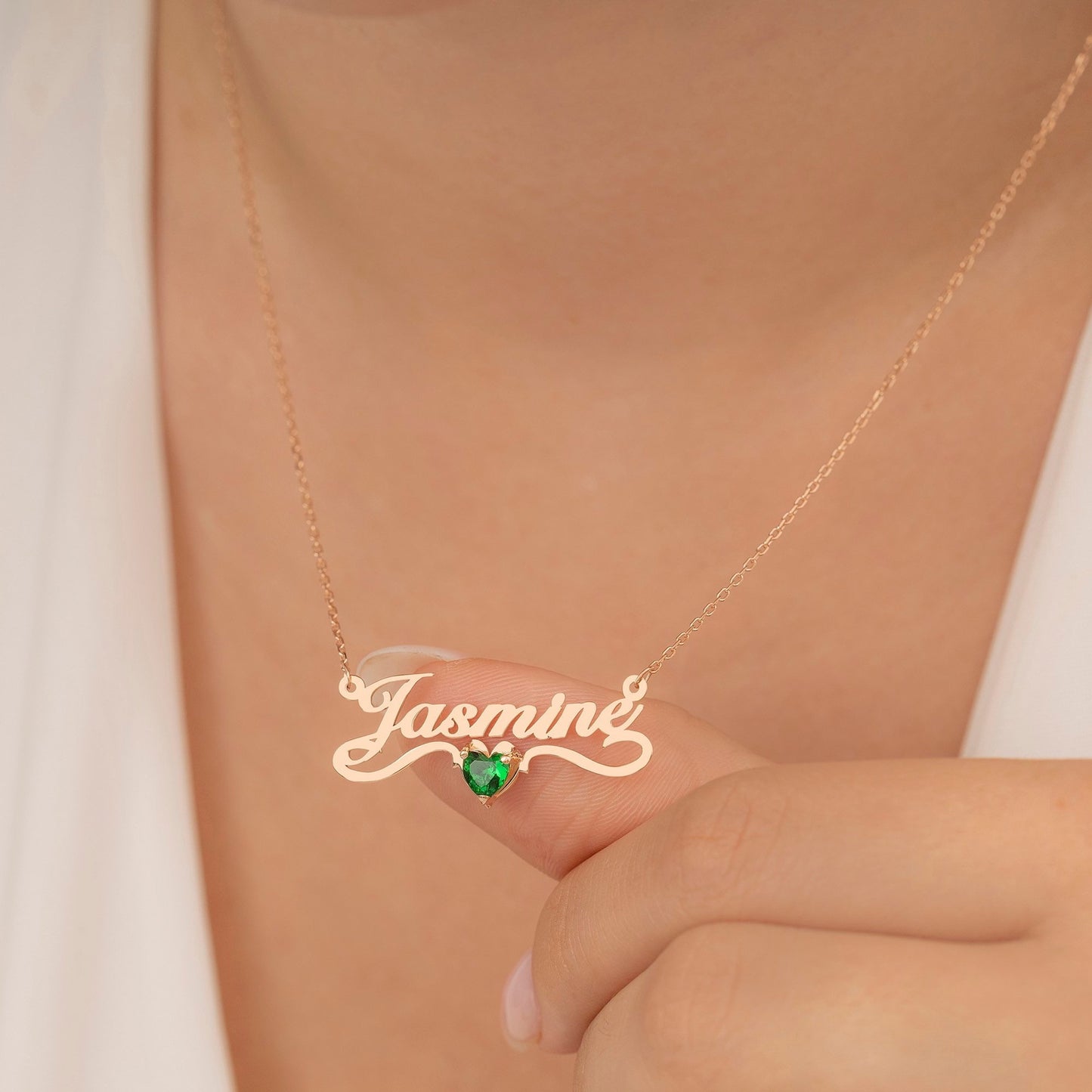 A woman wearing a Maramalive™ Personalized Name Necklace Stainless Steel with an added bonus of a Crystal of your choice with the name Danielle on it.