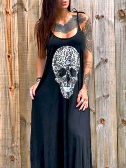 A woman in a ghoulishly glam black dress with a skull print wearing the Maramalive™ Drop Dead Gorgeous - Strap Style Skull Mid-length Print Dress.