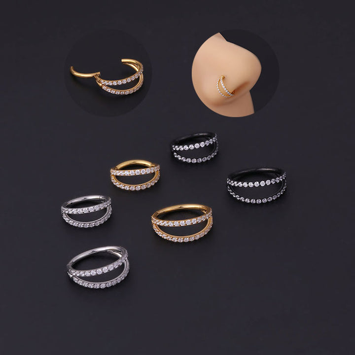 A set of Maramalive™ Stainless Steel Double Row Carved Zircon Seamless Nose Rings on a black surface.