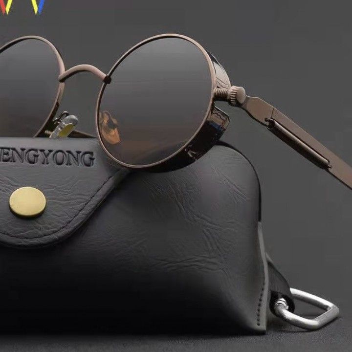 A pair of Maramalive™ Classic Gothic Steampunk Sunglasses Polarized Men Women sitting on top of a case.