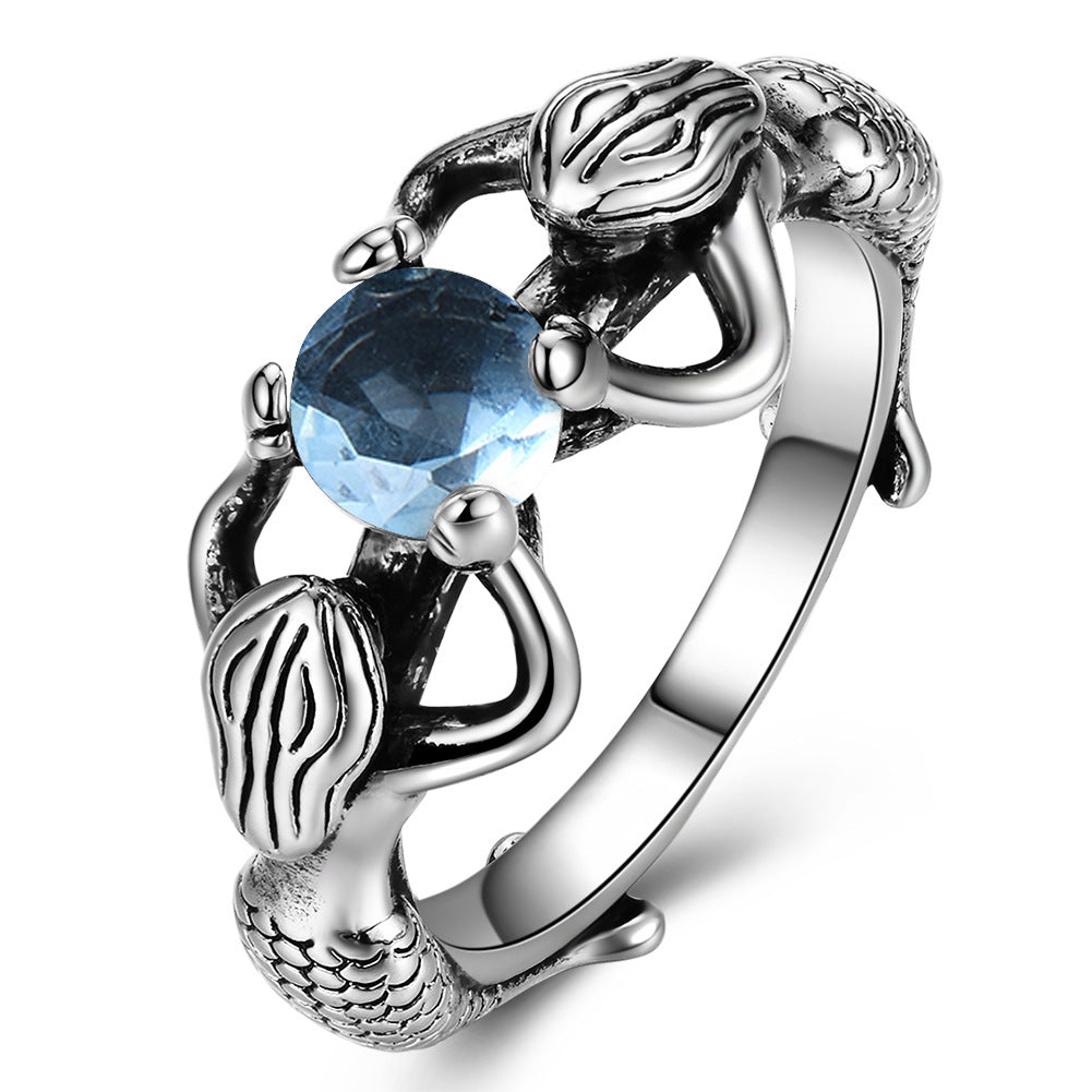 A Blue Diamond Mermaid Pearl Ring with a blue topaz stone by Maramalive™.