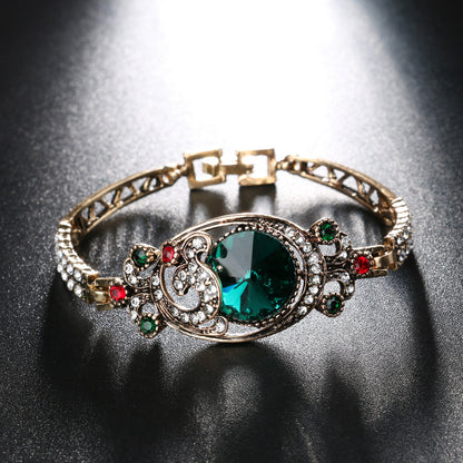 An Ethereal Elegance Crystal Bracelet with red and green stones by Maramalive™.