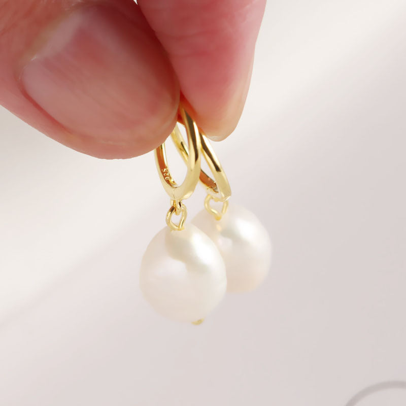 A pair of Maramalive™ Baroque Freshwater Pearl Earrings.