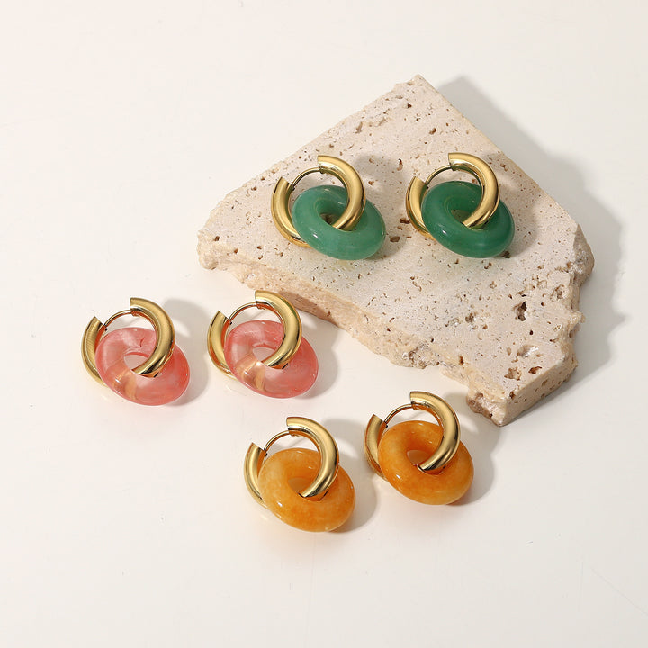 A set of Fashion Retro Natural Stone Ring Earrings For Women by Maramalive™ on a satin.