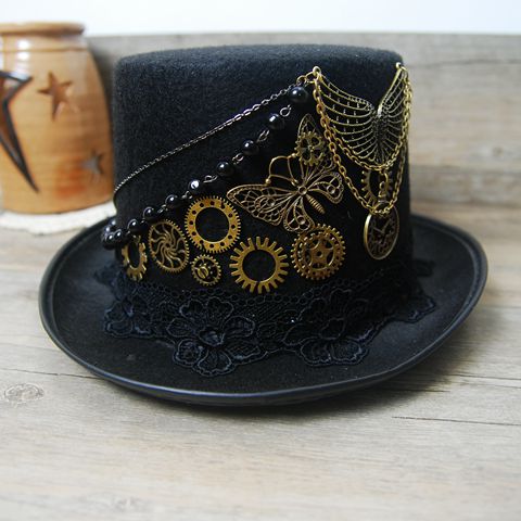 A woman wearing a Maramalive™ Steampunk bowler hat.