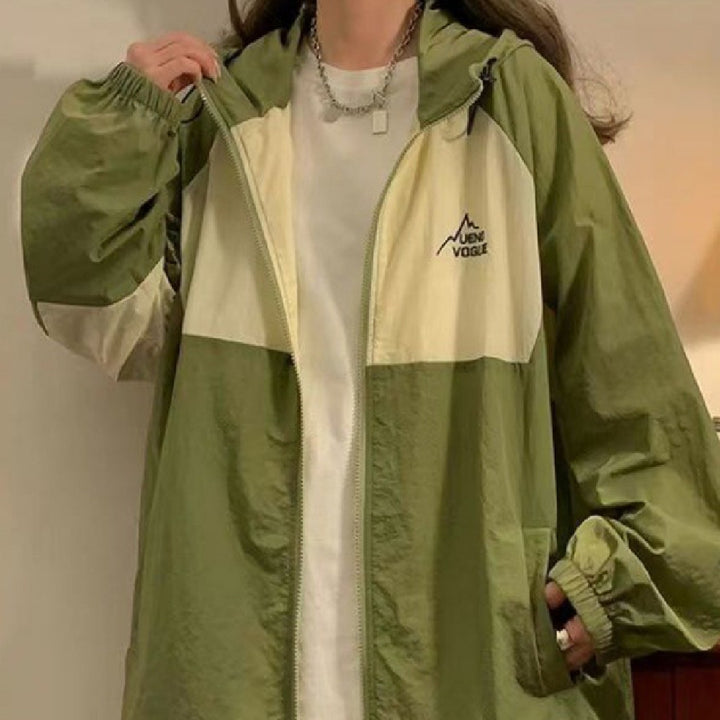 A woman wearing Maramalive™ UV protective attire in a green and white jacket.