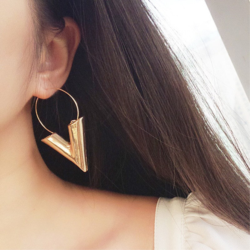 A pair of Minimalist Triangle Earrings from Maramalive™ on a white background.