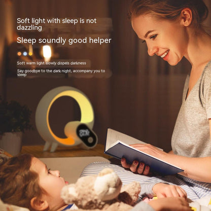 A Creative Q Light Analog Sunrise Digital Display Alarm Clock Bluetooth Audio Intelligent Wake-up Q Colorful Atmosphere lamp from Maramalive™ on a table.