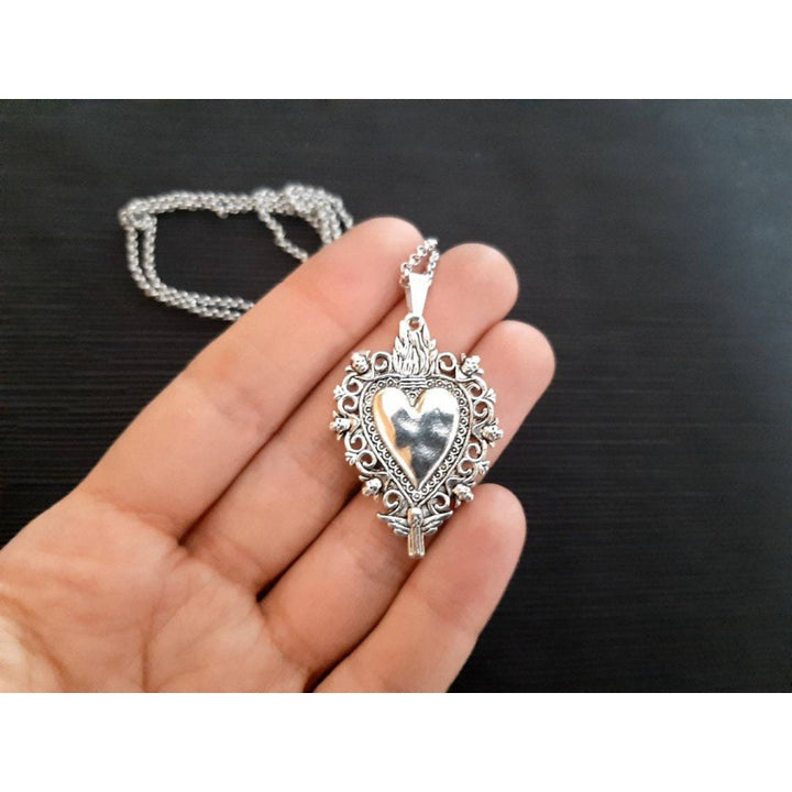 A beautiful Women's Gothic Sacred Heart Pendant Necklace on a black background necklace from Maramalive™.
