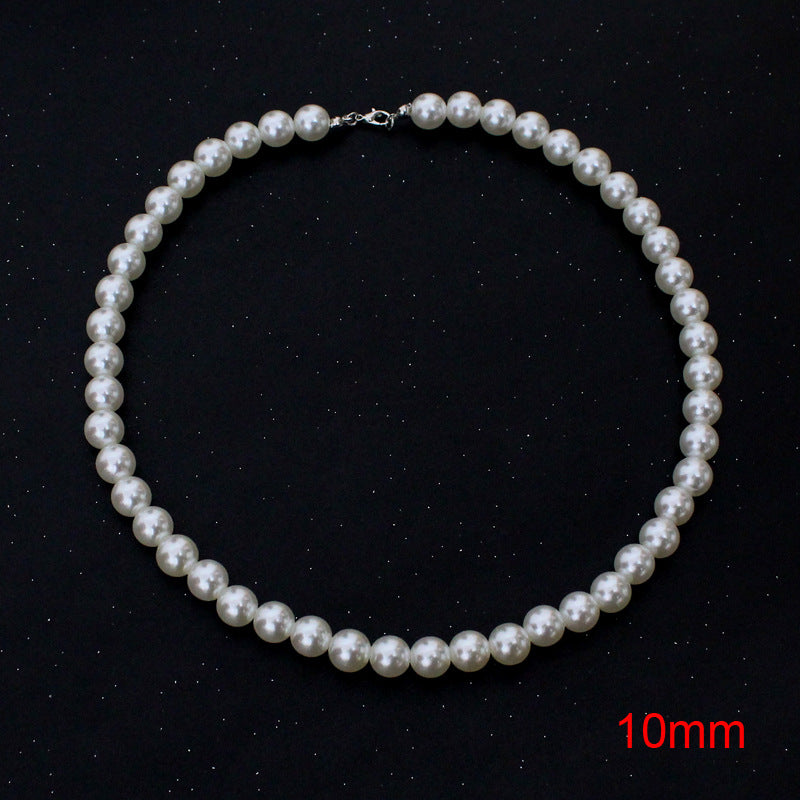 Three Maramalive™ white pearl necklaces on a black surface.