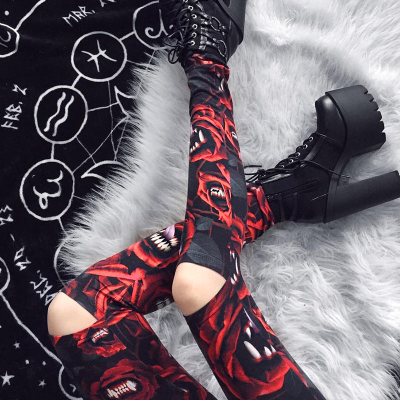 A woman taking a selfie in red and black Maramalive™ Gothic Rose Thigh-Highs - Gothic ladies tights.