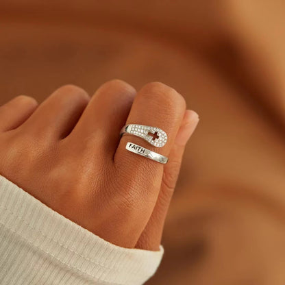 A woman wearing a Maramalive™ S925 Sterling Silver Faith Cross Zircon Ring.
