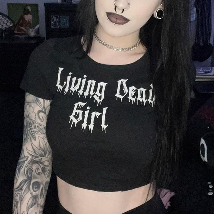 Person wearing a black Maramalive™ Gothic Style Printed Top Short Sleeve with "Living Dead Girl" printed on it, a choker necklace, and has tattoos and piercings.