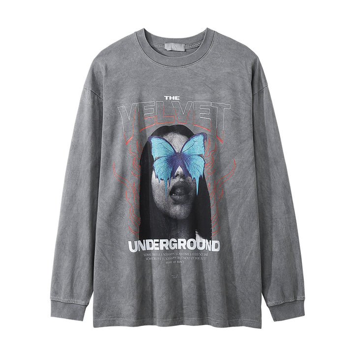 A collarless, gray long-sleeve T-shirt featuring a butterfly over a person's face with "The Velvet Underground" text and logo. Made from soft cotton, this Men's Dark Character Old Washed Long-sleeved T-shirt by Maramalive™ is available in Asian sizes for a perfect fit.