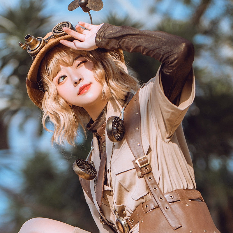 A girl in a hat holding a Maramalive™ Steampunk Summer Artifact Hanging Neck Three-speed Double USB Travel Mini Fan in the grass.