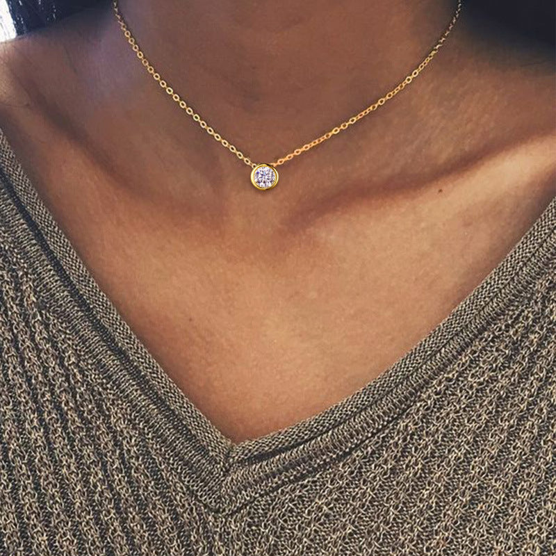 A woman wearing a Minimalist Zircon Clavicle Chain necklace from Maramalive™.