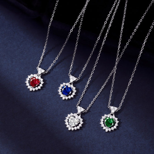Four Heart-shaped Diamond Jewelry Fashion Jewelry Set necklaces on a blue background.