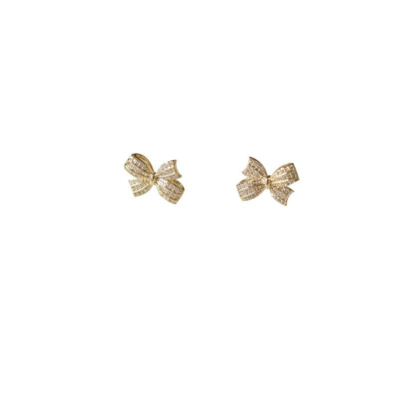 A woman wearing a Maramalive™ Retro Minority S925 Sterling Silver Butterfly Studs Women earring.
