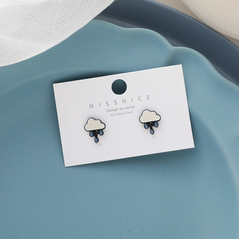 Graceful Cute Stud Earrings by Maramalive™ on a blue plate.