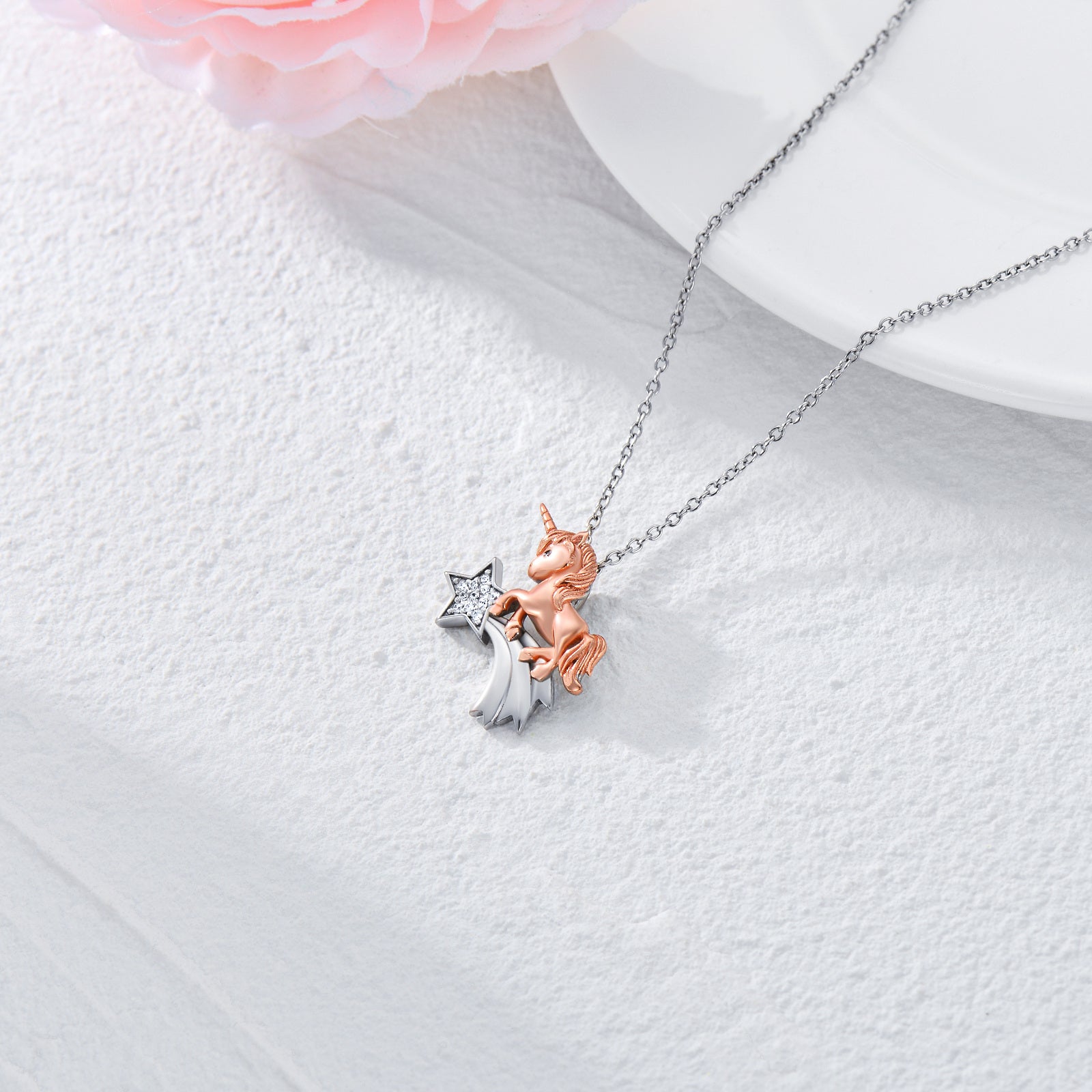 A Maramalive™ CZ Unicorn Horse Necklace in White & Rose Gold Plated Silver with a star on it.