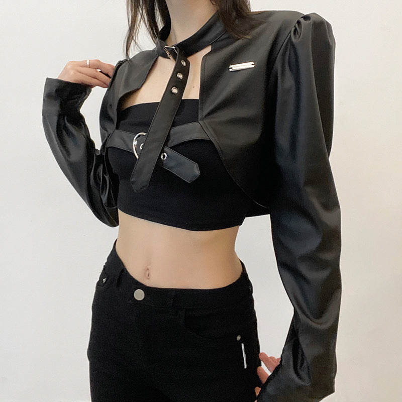 A woman wearing a Biker Chick Faux Leather Crop Jacket - Gothic Vegan Leather Top by Maramalive™ and white pants.