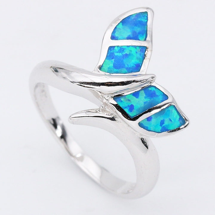 A Maramalive™ Opal Mermaid Tail Ring with a blue opal butterfly.