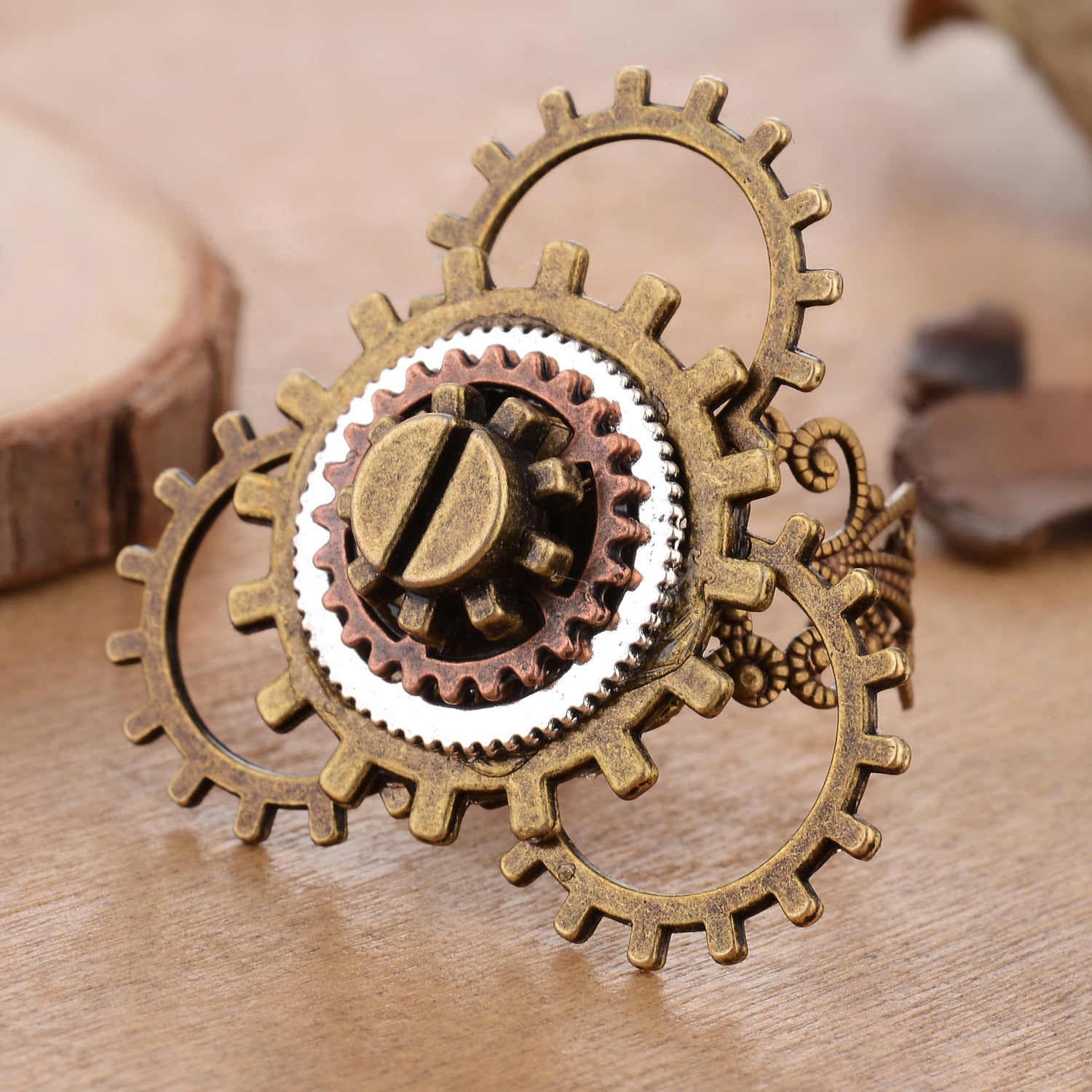 A woman's hand with a Maramalive™ Retro Steampunk 3 Ring Gear Ornament on it.