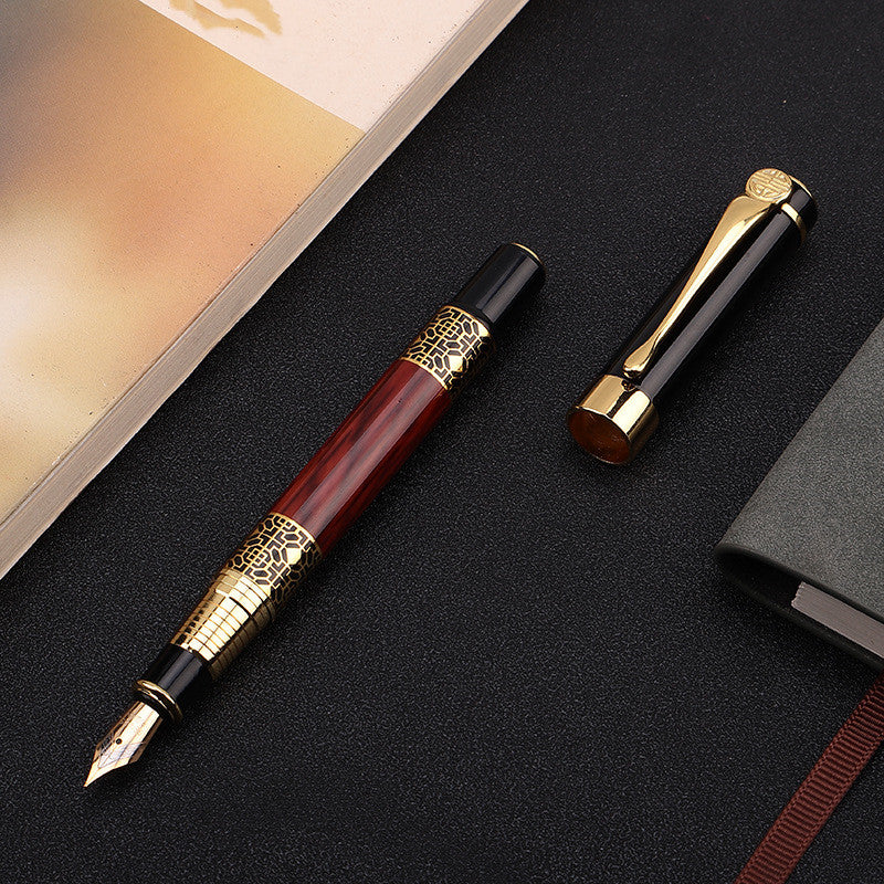 A Maramalive™ wood grain fountain pen metal signature pen and a book on a table.