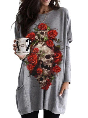 A woman wearing a gray dress with the Maramalive™ Halloween Skull Rose Print Pattern Long Sleeve on it.