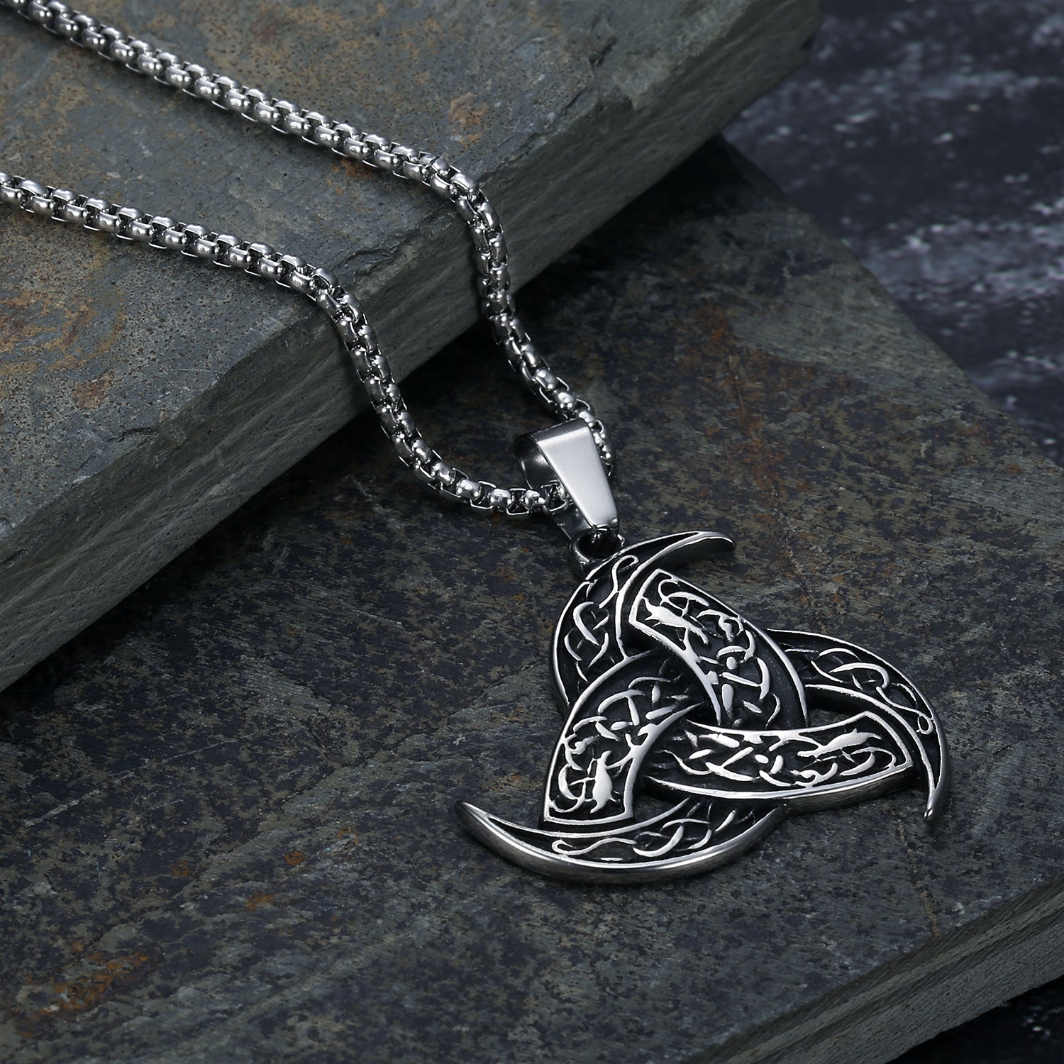 An Odin Horn Dragon Pendant Necklace on a rock. (Maramalive™)