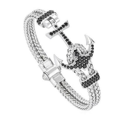 Three Men's Titanium Steel Diamond Boat Anchor Rope braided Bracelets with anchors on top of a marble table by Maramalive™.