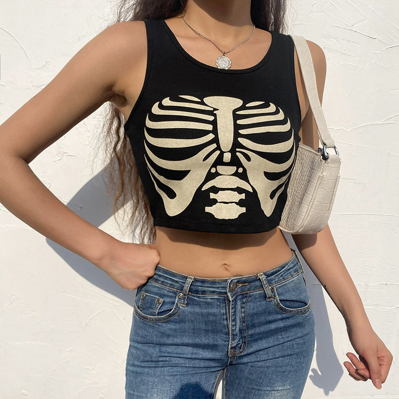 A person wearing a sleeveless black "Gothic Style Vest Skull Print Fashion" by Maramalive™ and blue jeans, holding a white handbag over their shoulder. The stylish top is made from a comfortable polyester fiber blend.
