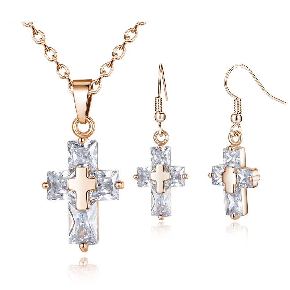 An Inspirational Statement Cross Pendant and Earring set in rose gold by Maramalive™.