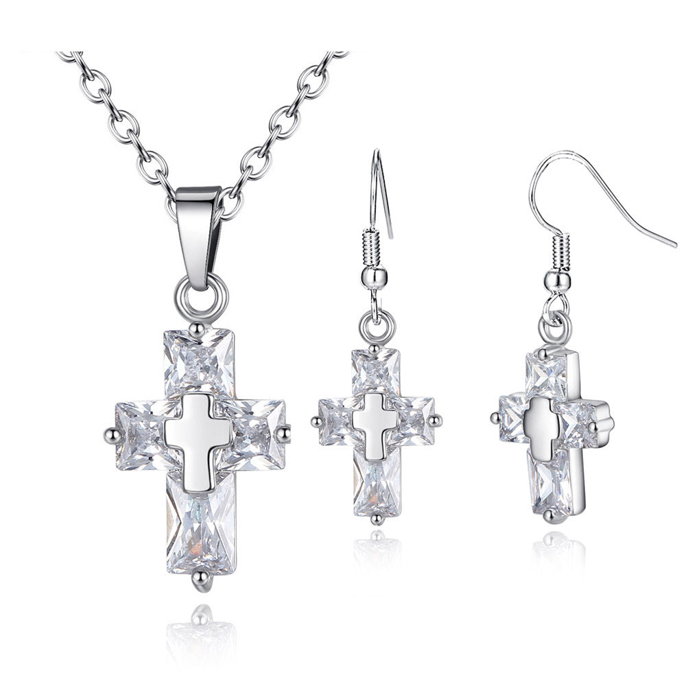 An Inspirational Statement Cross Pendant and Earring set in rose gold by Maramalive™.