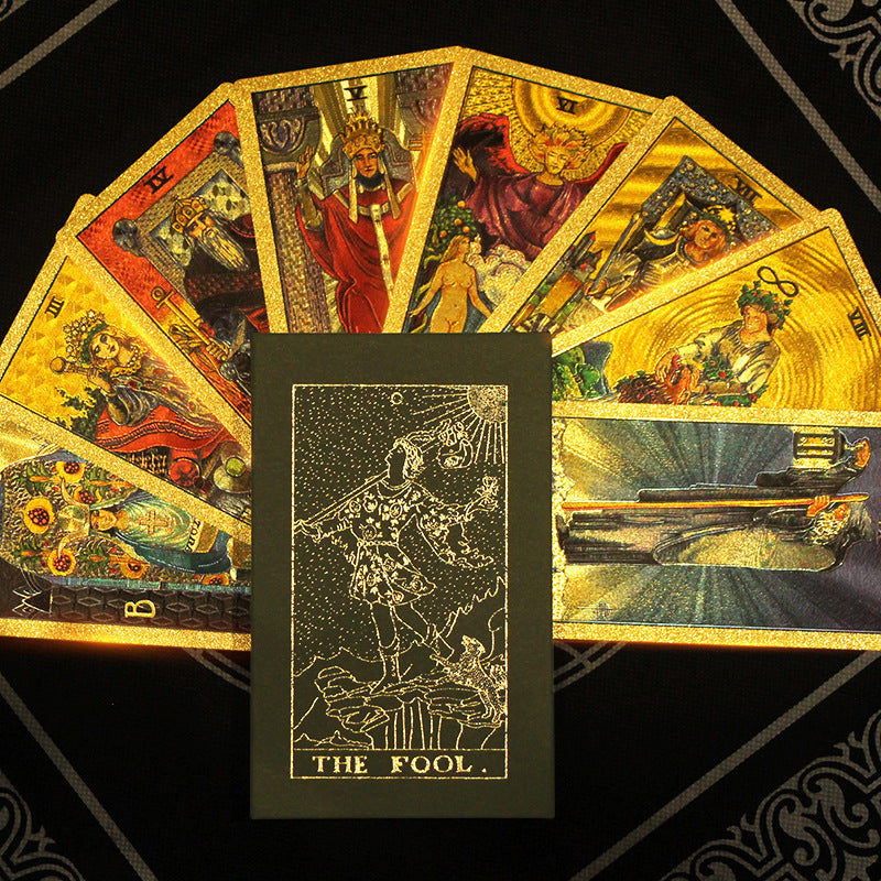 A Waterproof Tarot Instruction Board Game by Maramalive™ sitting on a black cloth.